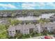 Beautiful aerial view of lakeside condos surrounded by lush greenery, providing a serene and picturesque living environment at 8140 Shorewalk Dr # C, Indianapolis, IN 46236
