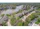 Aerial view of a residential area with waterfront residences, parking, and lush greenery at 8140 Shorewalk Dr # C, Indianapolis, IN 46236