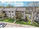 An aerial view showcases the building's surroundings, highlighting the landscaping and nearby parking at 8140 Shorewalk Dr # C, Indianapolis, IN 46236