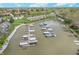 Aerial view of a residential area with a lake and boat docks surrounded by houses and trees at 8140 Shorewalk Dr # C, Indianapolis, IN 46236