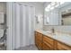 Bathroom featuring a single sink, light-colored walls, and an accordion-style door at 8140 Shorewalk Dr # C, Indianapolis, IN 46236