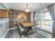 Dining area with an accent wall, new floors, and deck access, perfect for intimate meals at 8140 Shorewalk Dr # C, Indianapolis, IN 46236