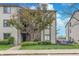 Attractive condo exterior featuring vinyl siding and mature landscaping around the building at 8140 Shorewalk Dr # C, Indianapolis, IN 46236