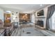 Charming living and dining area showcasing an accent wall, and deck access at 8140 Shorewalk Dr # C, Indianapolis, IN 46236
