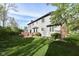 Spacious backyard with a well-maintained lawn, mature trees, and a deck perfect for outdoor entertaining at 8242 Windhaven Cir, Indianapolis, IN 46236