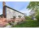 Expansive backyard featuring a red deck, mature trees, and plenty of space for outdoor activities at 8242 Windhaven Cir, Indianapolis, IN 46236