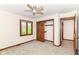 Bedroom with neutral carpet, ceiling fan, and closet at 8242 Windhaven Cir, Indianapolis, IN 46236