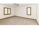 Bedroom with neutral carpet and windows with wooded trim at 8242 Windhaven Cir, Indianapolis, IN 46236