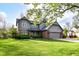 Charming gray two-story home with brick accents, well-maintained landscaping, and a lush green lawn at 8242 Windhaven Cir, Indianapolis, IN 46236