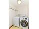 Laundry room with white appliances and overhead shelving at 8242 Windhaven Cir, Indianapolis, IN 46236