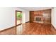 Living room featuring a brick fireplace, built-in bookshelves, and sliding doors to deck at 8242 Windhaven Cir, Indianapolis, IN 46236