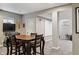 Finished basement featuring a dining table, entertainment center, and neutral carpeting at 8277 Plumwood Ln, Indianapolis, IN 46256