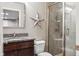 Charming bathroom with granite countertop, decorative mirror and tiled walk-in shower at 8277 Plumwood Ln, Indianapolis, IN 46256