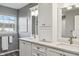 Bright bathroom featuring double sinks, quartz counters, and modern fixtures at 8277 Plumwood Ln, Indianapolis, IN 46256