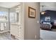 Open bathroom leading into a bedroom, featuring natural light and modern fixtures at 8277 Plumwood Ln, Indianapolis, IN 46256