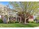 Charming brick home with lush front yard and mature trees offering shade and curb appeal at 8277 Plumwood Ln, Indianapolis, IN 46256
