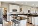 Bright kitchen with stainless steel appliances, granite countertops, and a functional center island at 8277 Plumwood Ln, Indianapolis, IN 46256