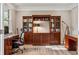Well-appointed home office with custom built-ins and a dedicated workspace for productivity at 8277 Plumwood Ln, Indianapolis, IN 46256