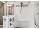 Modern bathroom featuring an all-tile shower with a built-in bench and glass doors at 8277 Plumwood Ln, Indianapolis, IN 46256