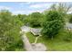 Aerial view showcases the property with its landscaping, detached garage, and inviting curb appeal at 840 N Indiana St, Mooresville, IN 46158