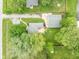 Aerial view of the home and garage with well-kept landscaping and neighboring properties at 840 N Indiana St, Mooresville, IN 46158
