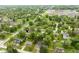 Aerial view of a home close to town featuring mature trees and well-maintained lawns at 840 N Indiana St, Mooresville, IN 46158