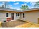 Backyard with a deck, stone exterior, and access to the yard at 840 N Indiana St, Mooresville, IN 46158
