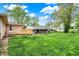 Expansive backyard featuring a deck and lush green grass, perfect for outdoor activities at 840 N Indiana St, Mooresville, IN 46158