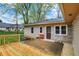Backyard featuring a deck, stone exterior, and access to the yard at 840 N Indiana St, Mooresville, IN 46158