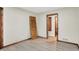 Bedroom with neutral paint, modern trim, hard wood floors, and an open doorway at 840 N Indiana St, Mooresville, IN 46158