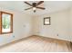 Bright bedroom with light-colored floors, neutral walls and three windows at 840 N Indiana St, Mooresville, IN 46158