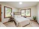 Inviting bedroom with natural light from three windows, and light-colored floors at 840 N Indiana St, Mooresville, IN 46158