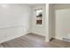 This bedroom features white shiplap and a window with a view of the home's exterior at 840 N Indiana St, Mooresville, IN 46158