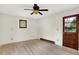 Bedroom with wood-look floors, a ceiling fan, and a door leading to the outdoors at 840 N Indiana St, Mooresville, IN 46158