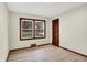 This bedroom features a light colored floor and wooden trim around the window and door at 840 N Indiana St, Mooresville, IN 46158