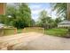 Backyard deck featuring a concrete patio area and wooden railing, offering an outdoor space at 840 N Indiana St, Mooresville, IN 46158