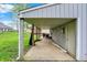 Covered carport area offering parking with access to the backyard and is great for storage and protection from the elements at 840 N Indiana St, Mooresville, IN 46158