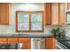 Kitchen showcasing wooden cabinets, subway tile backsplash, granite countertops, and stainless steel appliances at 840 N Indiana St, Mooresville, IN 46158