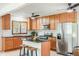 Well-equipped kitchen featuring wooden cabinetry, stainless steel appliances, and a functional center island at 840 N Indiana St, Mooresville, IN 46158