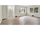 Bright living room featuring new floors, bay window, and fresh paint at 840 N Indiana St, Mooresville, IN 46158