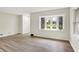 Bright living room featuring new floors, bay window, and fresh paint at 840 N Indiana St, Mooresville, IN 46158