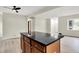 Open concept living area featuring hardwood floors and a large island with a dark countertop at 840 N Indiana St, Mooresville, IN 46158