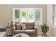 Cozy living room view showcasing a bay window, comfortable seating, and natural light streaming through at 840 N Indiana St, Mooresville, IN 46158