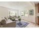 Inviting living room featuring a bay window, comfortable seating, and modern decor with light colored floors at 840 N Indiana St, Mooresville, IN 46158