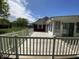 Spacious wooden deck in backyard of brick home with well maintained lawn at 89 Judy Dr, Martinsville, IN 46151