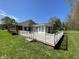 Spacious wooden deck in backyard of brick home with well maintained lawn at 89 Judy Dr, Martinsville, IN 46151