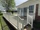 Wooden deck of brick home with sliding glass door and view of backyard at 89 Judy Dr, Martinsville, IN 46151