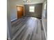 Bright bedroom featuring neutral paint, new flooring, closet, and plenty of natural light at 89 Judy Dr, Martinsville, IN 46151