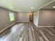 Large living room with fresh paint, recessed lighting, and new, stylish flooring at 89 Judy Dr, Martinsville, IN 46151