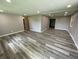 Large living room with fresh paint, recessed lighting, and new, stylish flooring at 89 Judy Dr, Martinsville, IN 46151